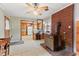 Living room features a wood fireplace and opens to the kitchen at 1593 E Washington Ave, Creedmoor, NC 27522