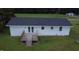 Overhead aerial view showing the back of house with patio doors and a wooden deck at 1676 Richardson Bass Rd, Kenly, NC 27542