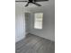 Well-lit bedroom featuring built-in shelving and a window overlooking a pleasant view at 1676 Richardson Bass Rd, Kenly, NC 27542