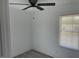 A bright bedroom with a ceiling fan and a window providing ample natural light at 1676 Richardson Bass Rd, Kenly, NC 27542