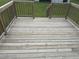 Well-maintained wooden deck with ample space for outdoor furniture and gatherings at 1676 Richardson Bass Rd, Kenly, NC 27542