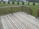 Spacious wooden deck provides an ideal spot for outdoor relaxation and entertaining at 1676 Richardson Bass Rd, Kenly, NC 27542