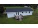 Inviting single-story home featuring a rear deck and a spacious yard with agricultural views at 1676 Richardson Bass Rd, Kenly, NC 27542