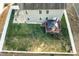 Aerial view of a home with a spacious backyard, gazebo, and well-maintained lawn at 1716 Longmont Dr, Wake Forest, NC 27587