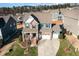 A stunning aerial view of this two-story home with a two-car garage, manicured lawn, and cozy front porch at 1716 Longmont Dr, Wake Forest, NC 27587