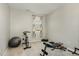 Exercise room features exercise equipment and weights near a window providing natural light at 1716 Longmont Dr, Wake Forest, NC 27587