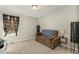 Neutral bedroom with carpet, sofa, and side table lamp provides a cozy retreat at 1716 Longmont Dr, Wake Forest, NC 27587