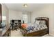 Neutral bedroom with carpet, bed, desk, and chair provides a quiet retreat at 1716 Longmont Dr, Wake Forest, NC 27587