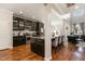 Modern kitchen with stainless steel appliances, granite countertops, and stylish dark cabinetry at 1716 Longmont Dr, Wake Forest, NC 27587