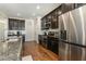 Modern kitchen with stainless steel appliances, granite countertops, and ample storage at 1716 Longmont Dr, Wake Forest, NC 27587