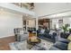 Open-concept living area with hardwood floors and great natural light at 1716 Longmont Dr, Wake Forest, NC 27587
