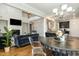 Open concept living space with fireplace and kitchen view at 1716 Longmont Dr, Wake Forest, NC 27587