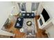 Bright living room boasts hardwood floors, fireplace, stylish furniture, and an abundance of natural light at 1716 Longmont Dr, Wake Forest, NC 27587