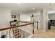 Upper loft features a wood railing and carpeting at 1716 Longmont Dr, Wake Forest, NC 27587