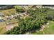 Aerial view of a neighborhood with houses, green spaces, and wooded areas at 176 Lowery Ln, Benson, NC 27504