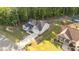 Aerial view showcasing a home's location, landscaped yard, and proximity to neighboring houses at 176 Lowery Ln, Benson, NC 27504