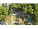 Aerial view of a property with a private backyard oasis including a pool, hot tub, and wooden deck at 176 Lowery Ln, Benson, NC 27504