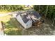Aerial view of a gray home with a spacious screened-in porch and large backyard with lush landscaping at 176 Lowery Ln, Benson, NC 27504