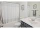 Bathroom featuring a tub/shower combo and vanity with a framed mirror at 176 Lowery Ln, Benson, NC 27504