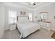 Bright primary bedroom with tray ceiling, neutral carpet, and ample natural light at 176 Lowery Ln, Benson, NC 27504