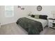 Bedroom featuring a queen bed, neutral walls, and ample natural light at 176 Lowery Ln, Benson, NC 27504