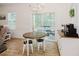 Bright breakfast nook with round table, patio access and elegant chandelier at 176 Lowery Ln, Benson, NC 27504