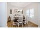 Formal dining room with wainscoting, modern lighting, and stylish décor at 176 Lowery Ln, Benson, NC 27504