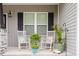 Relaxing front porch with rocking chairs, plants, and decorative accents at 176 Lowery Ln, Benson, NC 27504
