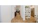 Bright hallway with hardwood floors, leading to the living room and kitchen at 176 Lowery Ln, Benson, NC 27504