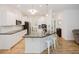 Spacious kitchen with white cabinets, a dark countertop island, and barstool seating at 176 Lowery Ln, Benson, NC 27504