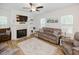 Cozy living room featuring a fireplace, built-in shelves, and comfortable seating at 176 Lowery Ln, Benson, NC 27504