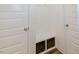 Mudroom with white wainscoting, wood-look floors, and built-in bench with storage at 176 Lowery Ln, Benson, NC 27504
