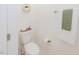 Clean powder room with decorative shelving and crisp white walls at 176 Lowery Ln, Benson, NC 27504