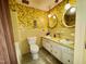 Retro bathroom featuring tiled shower/tub, a double sink, and floral wallpaper at 1818 Brookrun Rd, Henderson, NC 27536