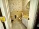 Bathroom featuring a vanity, toilet, and seashell themed wallpaper at 1818 Brookrun Rd, Henderson, NC 27536