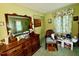 Bedroom featuring vintage design elements, a mirror, and a chair at 1818 Brookrun Rd, Henderson, NC 27536