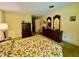 Vintage bedroom featuring matching furniture, floral bedding, and a quaint, retro design at 1818 Brookrun Rd, Henderson, NC 27536