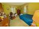 Bedroom features green carpets, a cozy chair, and coordinated curtains and bedding at 1818 Brookrun Rd, Henderson, NC 27536