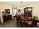 Dining room with wood table and chairs plus a china cabinet at 1818 Brookrun Rd, Henderson, NC 27536