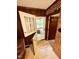 View of wood-paneled entryway with open doors to a porch and interior, revealing the home's character at 1818 Brookrun Rd, Henderson, NC 27536