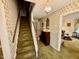 Hallway and staircase with vintage wallpaper and carpet at 1818 Brookrun Rd, Henderson, NC 27536