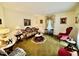 Living room with floral print sofa and vintage furniture at 1818 Brookrun Rd, Henderson, NC 27536