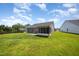 Spacious backyard featuring a patio, screened-in porch, and plenty of room to roam at 1828 Wellspring Ct, Graham, NC 27253