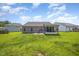 The backyard offers a patio and a screened-in porch perfect for relaxing outdoors at 1828 Wellspring Ct, Graham, NC 27253