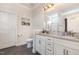 Bathroom with double granite countertop vanity and a separate toilet room at 1828 Wellspring Ct, Graham, NC 27253