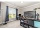 Comfortable bedroom with a large window, desk and decorative elements and plenty of natural light at 1828 Wellspring Ct, Graham, NC 27253