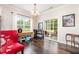 Dining area with large windows and a sliding door leading to the outdoor patio at 1828 Wellspring Ct, Graham, NC 27253