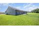 View of the home's exterior, showcasing the well-maintained lawn and outdoor space at 1828 Wellspring Ct, Graham, NC 27253