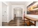 Inviting hallway featuring hardwood floors, and a view of the front entrance at 1828 Wellspring Ct, Graham, NC 27253