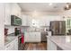 Modern kitchen with white cabinets, stainless steel appliances, and granite countertops at 1828 Wellspring Ct, Graham, NC 27253